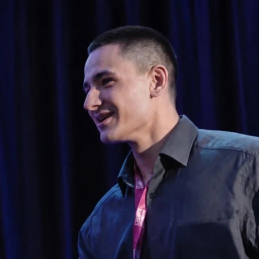 William Stoops, smiling, on stage